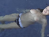 Solo amateur bombshell blonde Sarah takes a naked swim