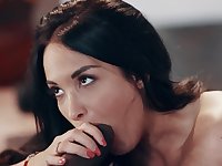 Busty brunette loves stuffing her mouth with a giant black rod